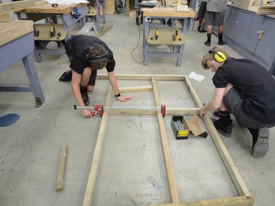 Dean and Connor piecing one of the wall frame together
